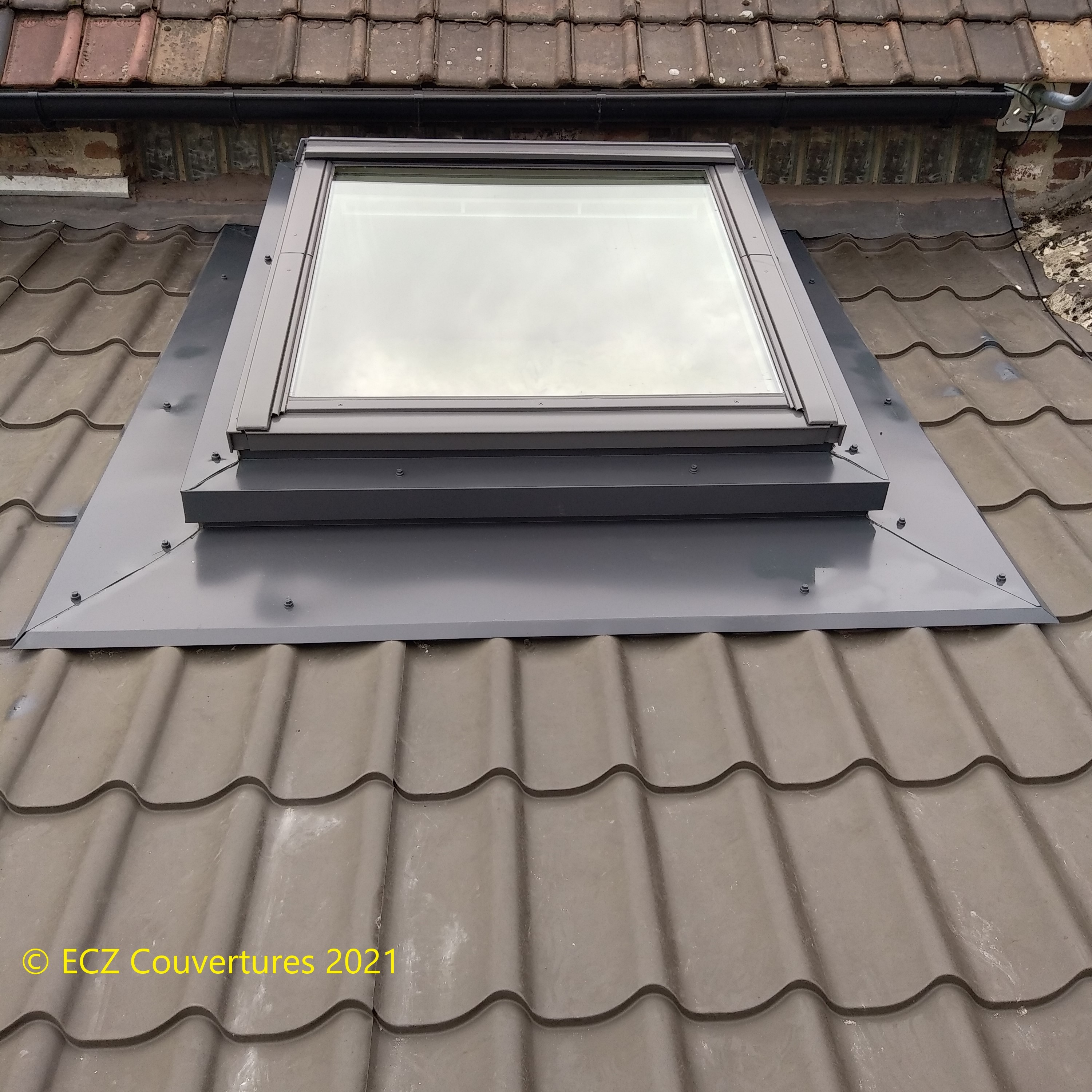 Pose d'un velux sur réhausse pour bac acier 